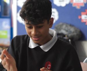 A picture of a secondary school pupil playing a game in class
